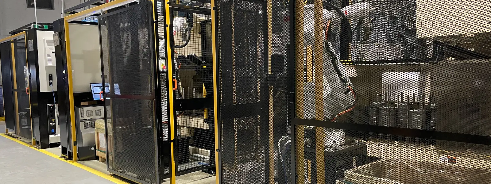 Three cells at Hastech, a Linamar Corporation company, that perform random bin picking / machine tending of automotive parts.