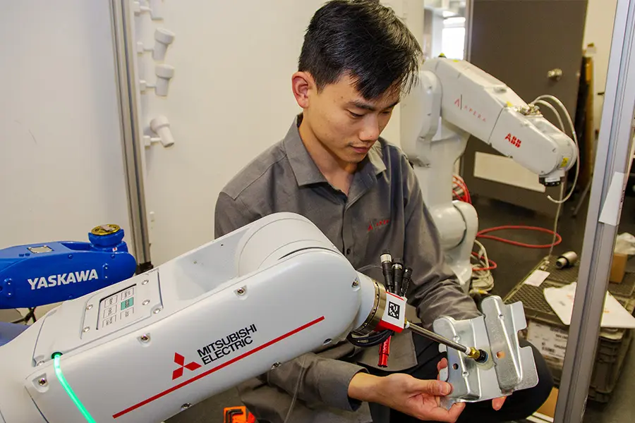 Peter Wang is a robotics solutions engineer who works with manufacturing customers to implement AI robotic picking.